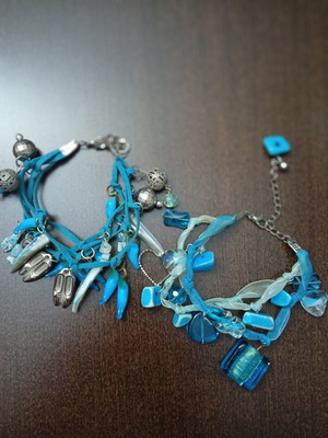 Bracelets set of 2 like new with glass beads and metal details