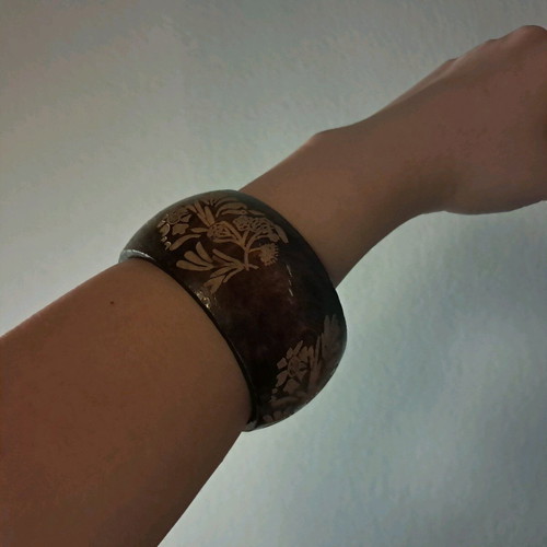 Wooden bracelet with designs like new, beige and brown