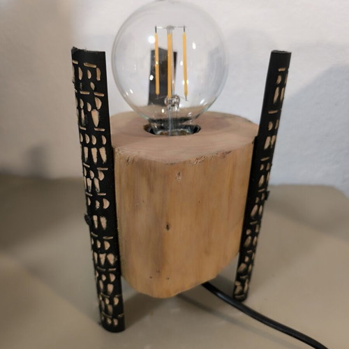 Handmade table lamp from solid wood trunk with carved black legs