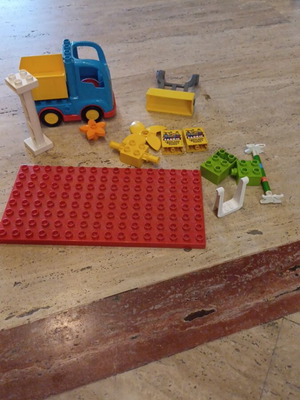 Lego Duplo set with 16 pieces including truck and excavator parts