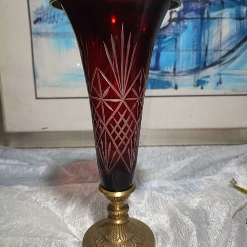 Vintage red glass vase with cut designs and decorative brass base and rim