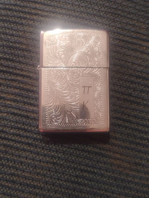 Zippo lighter with engraved design