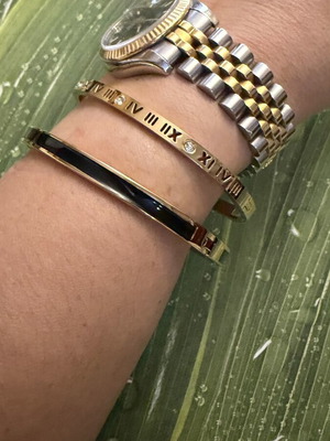 Set of 2 steel bracelets with gold and black details, new