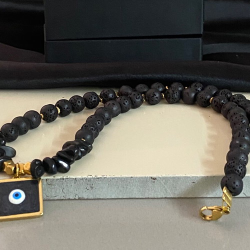 Handmade necklace with black lava stones and protective eye new