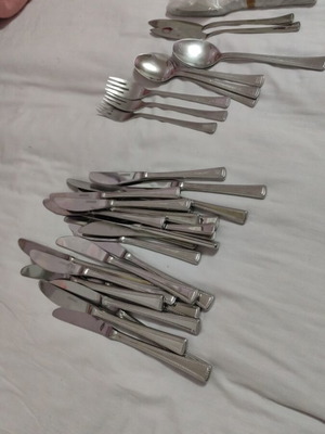 Stainless steel cutlery like new, with extra knives and fish knives