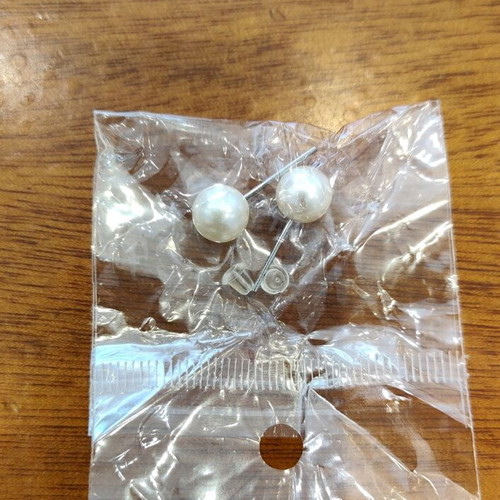Two pairs of earrings new, pearl and infinity with silicone clasp