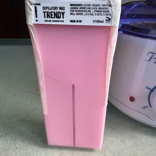 Pro-Wax 100 wax warmer used for hair removal with accessories