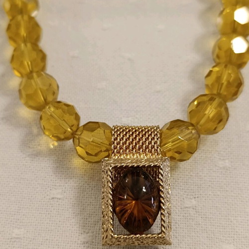 Necklace new with round glass bead and smoky quartz