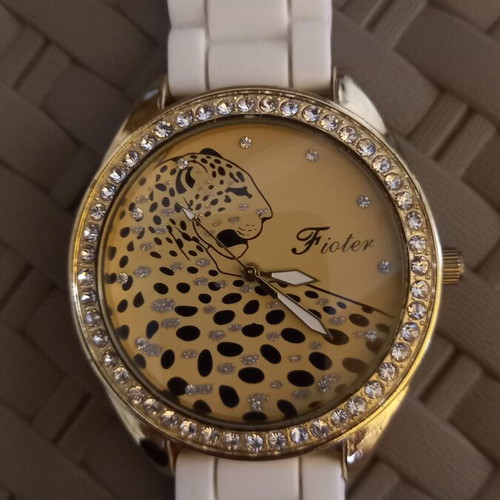 Women's wristwatch with rhinestones, white plastic strap