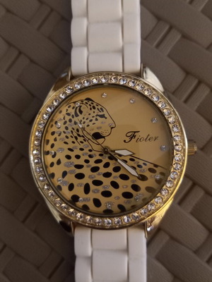 Women's wristwatch with rhinestones, white plastic strap
