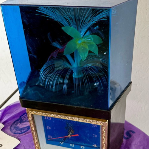 Vintage clock with optical fibers and rotating flower used