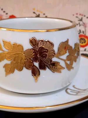 Tea cup with 22k gold and saucer like new, antique