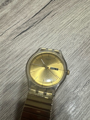 Swatch Dazzling Light χρυσαφί μπρασελέ από ανοξείδωτο ατσάλι μεταχειρισμένο σε καλή κατάσταση