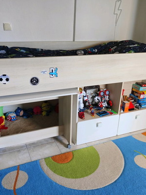 Bed with integrated bookshelf, detachable desk and chair used