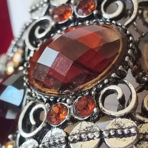 Vintage cuff bracelet with large brown stones and decorative details