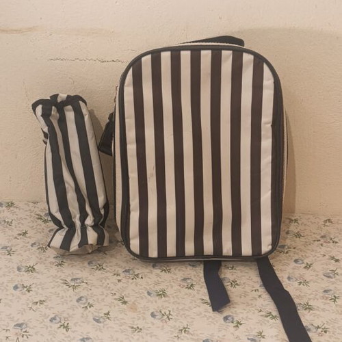 Insulated backpack with bottle holder like new, black and white striped