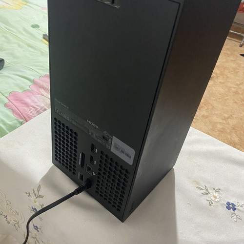 Xbox Series X console used with black wireless controller