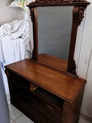 Vintage boudoir with large mirror, carvings, spacious surface and drawers used
