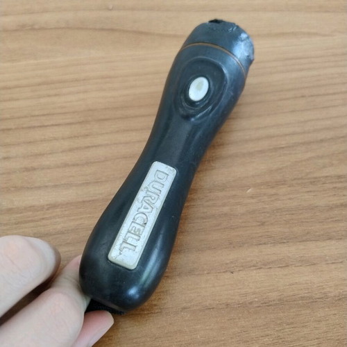 Duracell flashlight used with wear on front part