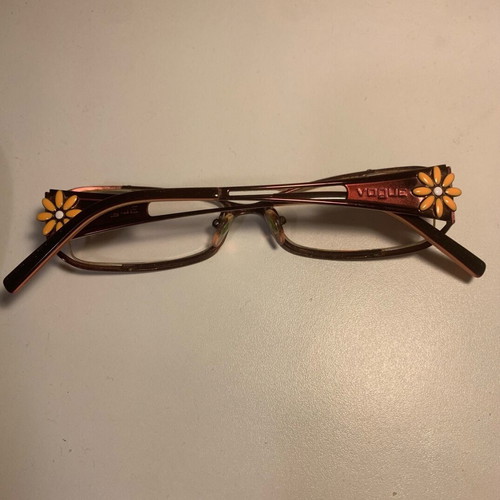 Vogue eyeglasses like new with daisy design