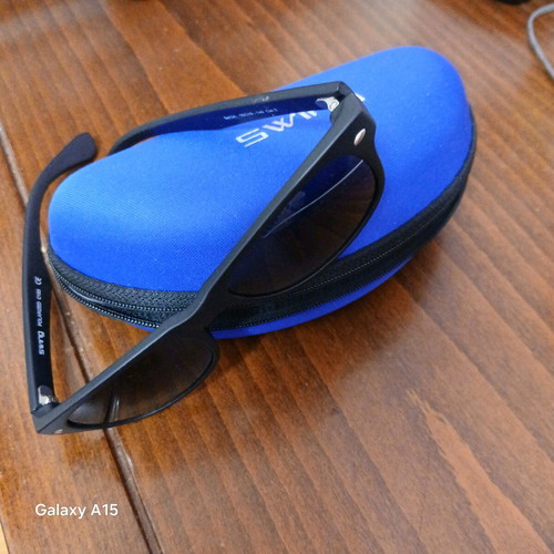 Swing sunglasses new with black plastic frame and men's lenses
