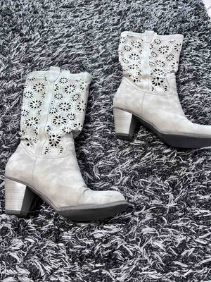 Women's beige boots used, below knee with perforated design