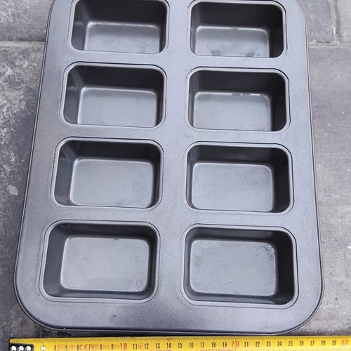 Nonstick baking pan with 8 rectangular molds for mini cakes and buns