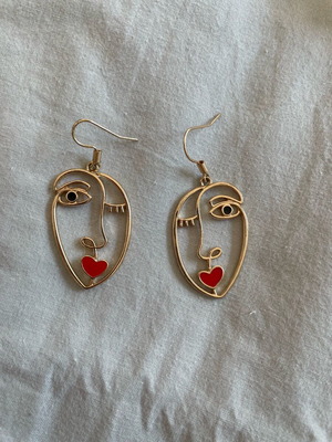 Earrings with face design like new