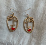 Earrings with face design like new