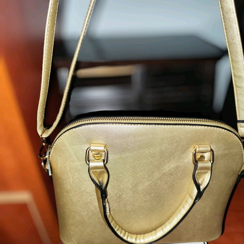 Gold handbag like new with detachable strap