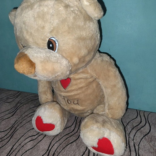 Large teddy bear with hearts used