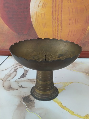 Vintage carved metal candlestick used