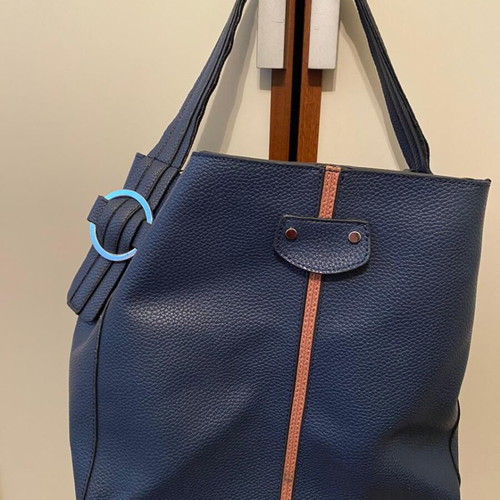 Blue shoulder bag used with brown details