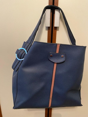 Blue shoulder bag used with brown details