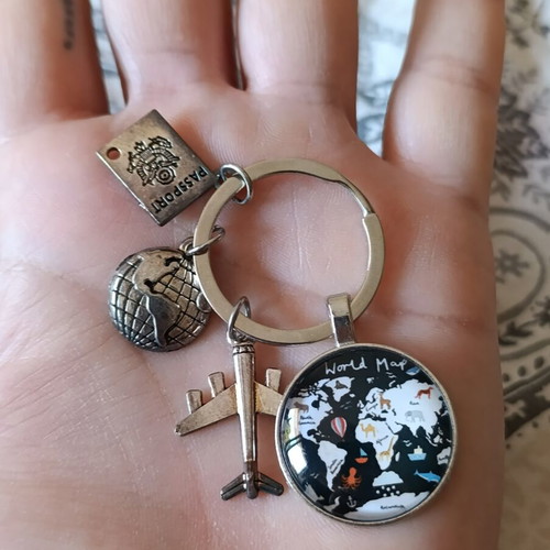 Travel keychain with world map design