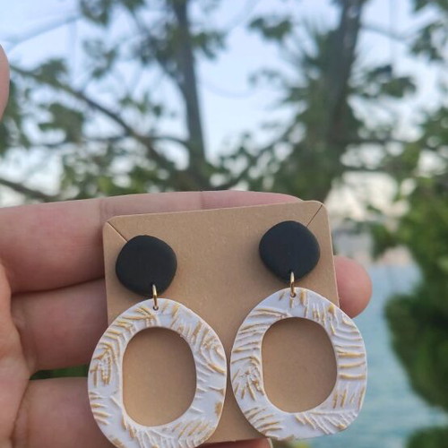 Earrings new, polymer clay with black, white, and gold colors