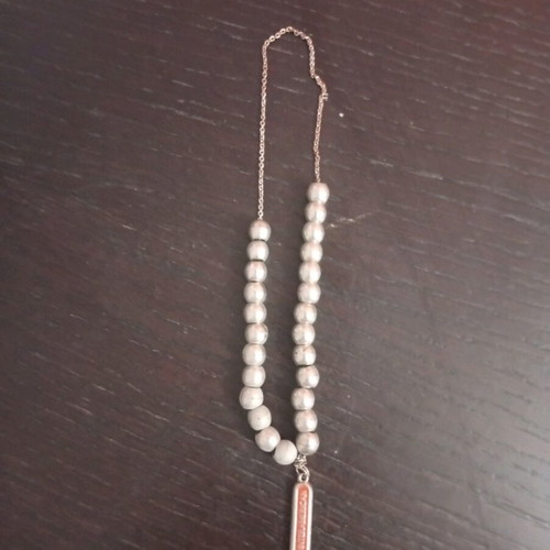 Worry beads used with metal element and Interamerican logo