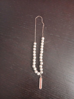 Worry beads used with metal element and Interamerican logo