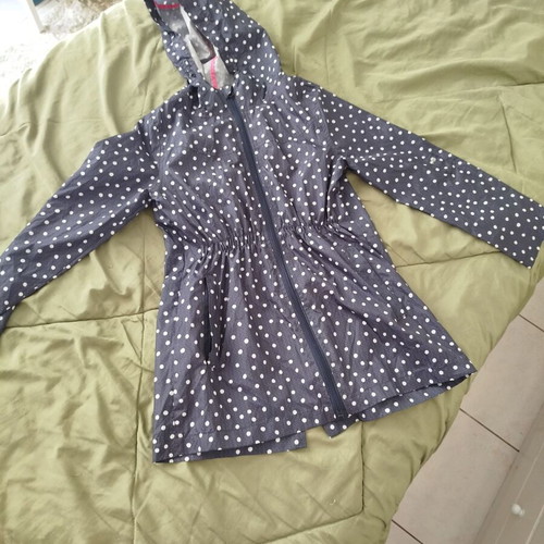 Girls' pocket raincoat 10-11 years like new, blue with white polka dots