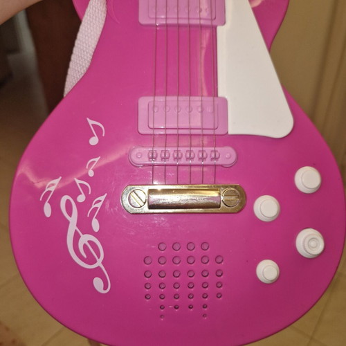 Children's guitar with sound like new