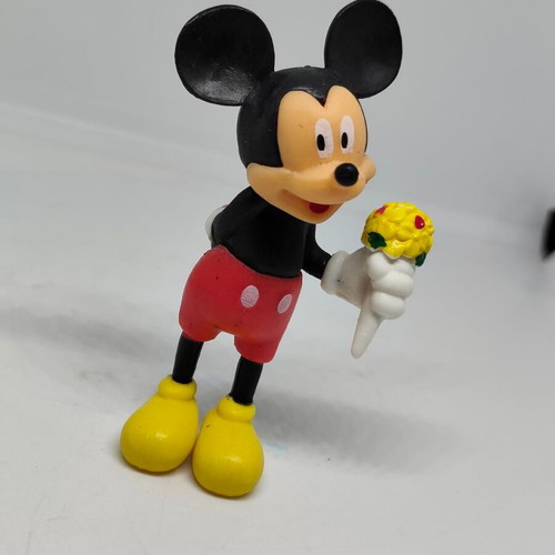 Collectible Mickey Mouse figure like new with bouquet