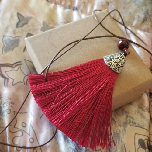 Necklace with red tassel used