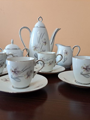 German porcelain set like new with silver details