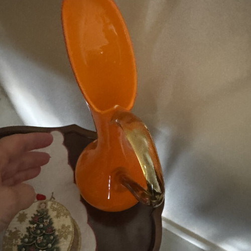 Vintage orange pitcher with slight handle defect