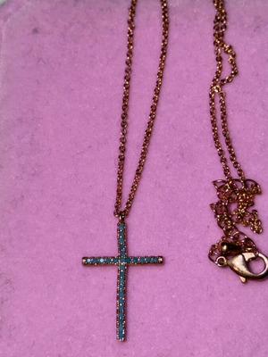 Cross pink gold color with blue stones and chain like new