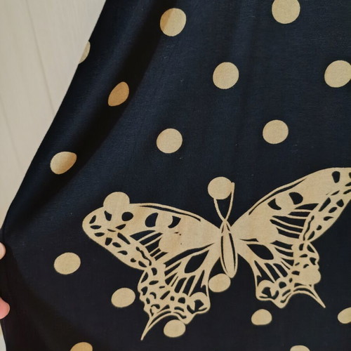 Black oversized t-shirt with gold/beige polka dots and butterflies like new