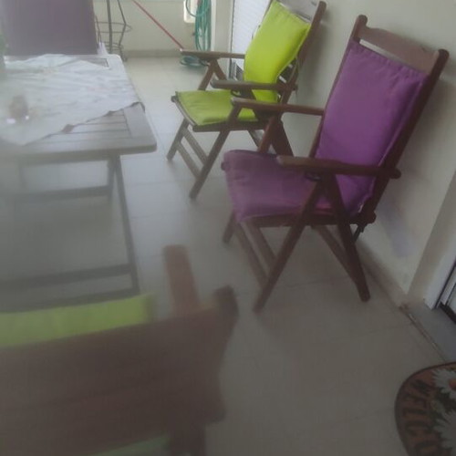 Balcony table with 4 wooden folding chairs used