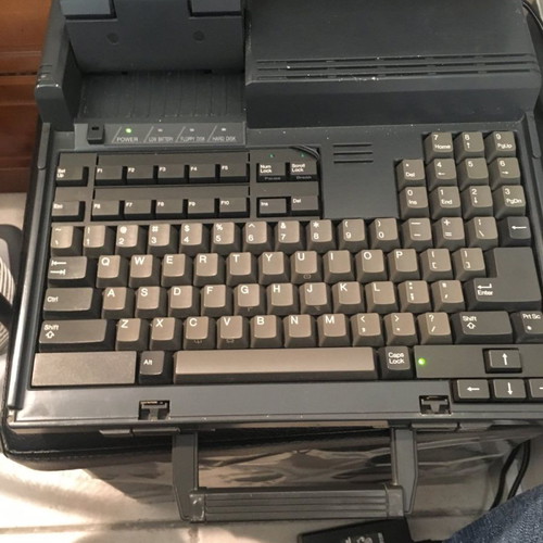 Sharp PC-4500 laptop collectible with charger