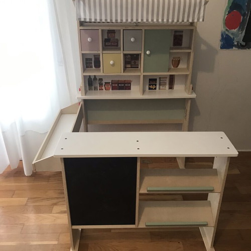 Wooden play shop with accessories and blackboard