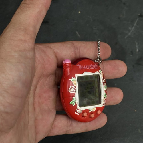 Vintage Tamagotchi Bandai 2004 red tropical design electronic keychain used